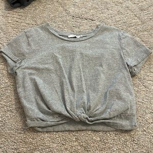 Lush grey crop top with cute tie in front. Size medium.